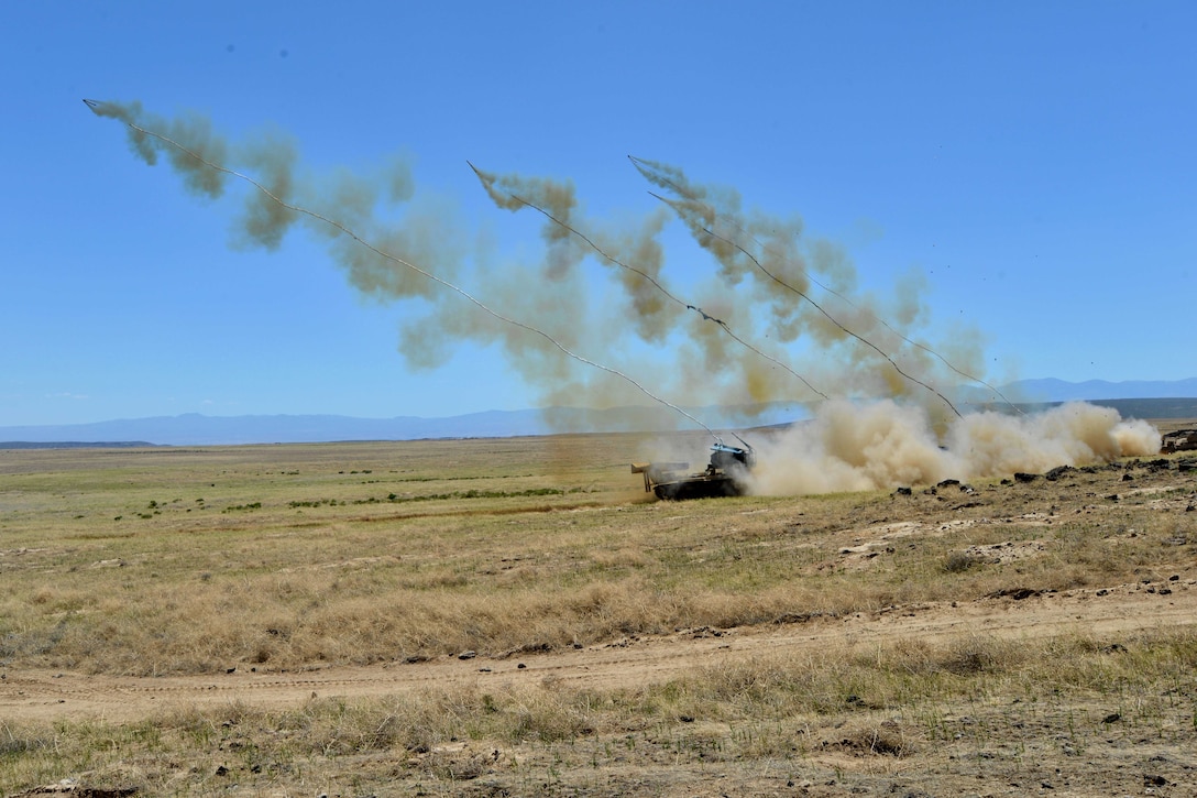 Soldiers fire multiple M58 mine clearing line charges during a live-fire range.