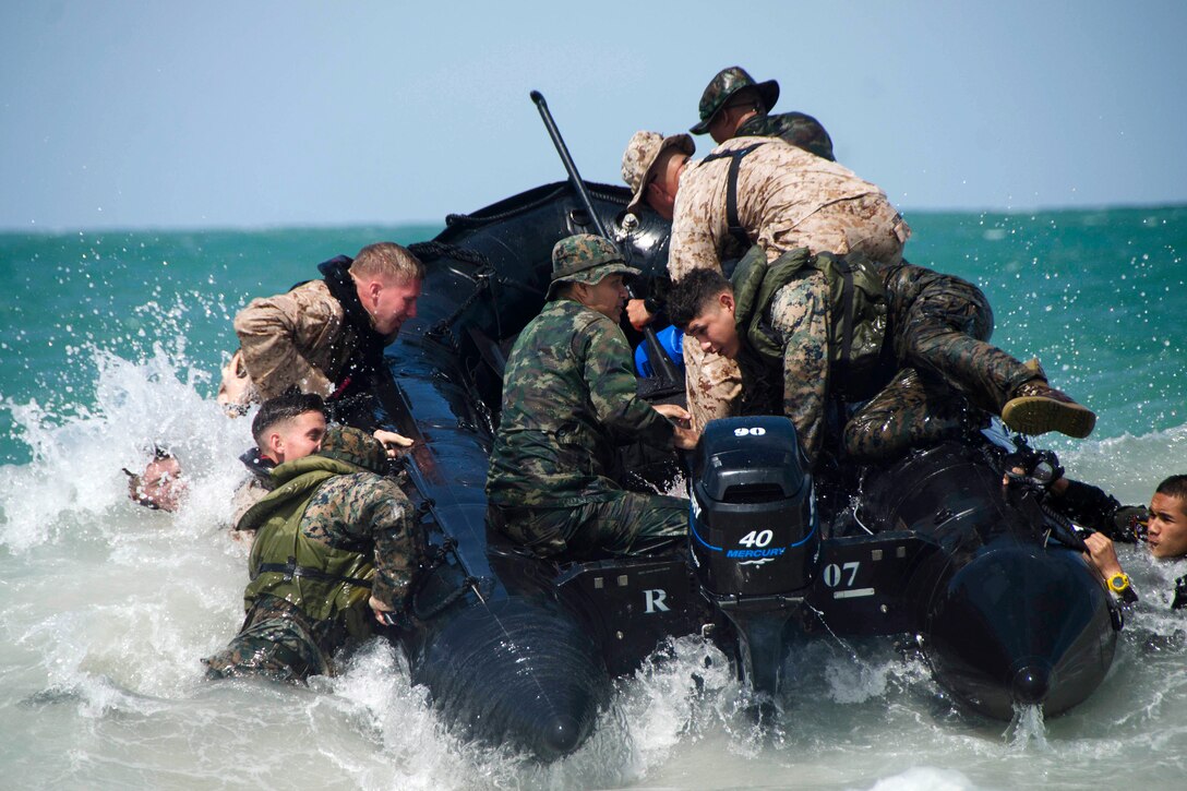 U.S and Royal Thai marines fight the waves conducting combat rubber raiding boat operations.