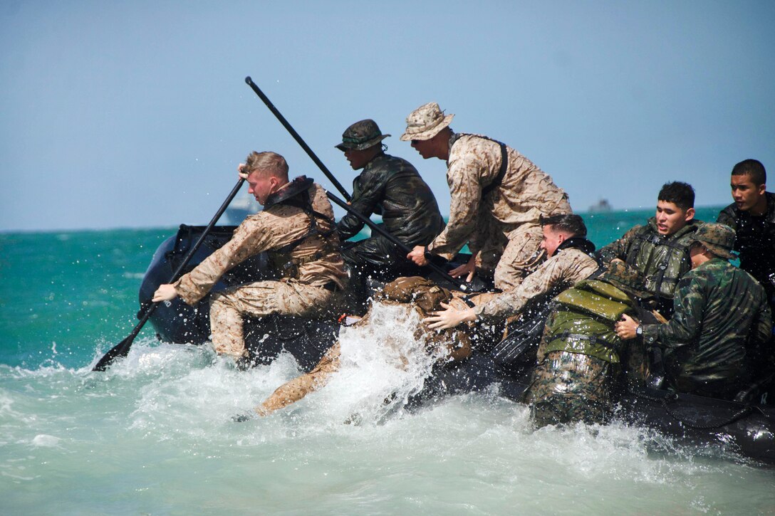 U.S and Royal Thai marines conduct combat rubber raiding boat operations.