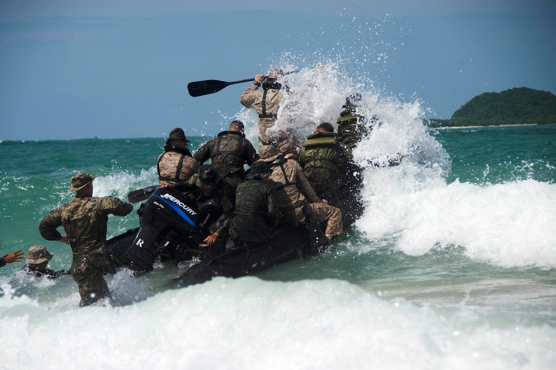 U.S and Royal Thai marines take a wave head-on while conducting combat rubber raiding boat operations.