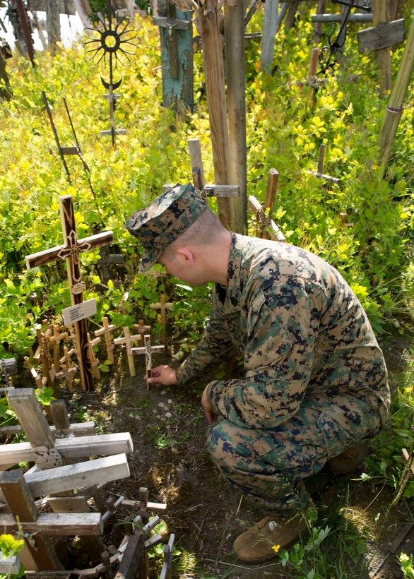 at the historical Hill of Crosses in Siauliai, Lithuania, June 8, 2018, during Exercise Saber Strike 18. The Marines participating in Saber Strike 18, a U.S. joint and multinational exercise conducted at various locations throughout the Baltic States and Poland, took an opportunity to visit the historic site to recognize and learn some of the culture of Lithuania. (U.S. Marine Corps photo by Sgt Adwin Esters/Released)