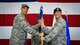 Col. Kevin Mantovani, 51st Mission Support Group commander, left, presents the guidon to Maj. Stephen Addington, 51st Security Forces Squadron commander, during a change of command at Osan Air Base, Republic of Korea, June 22, 2018.