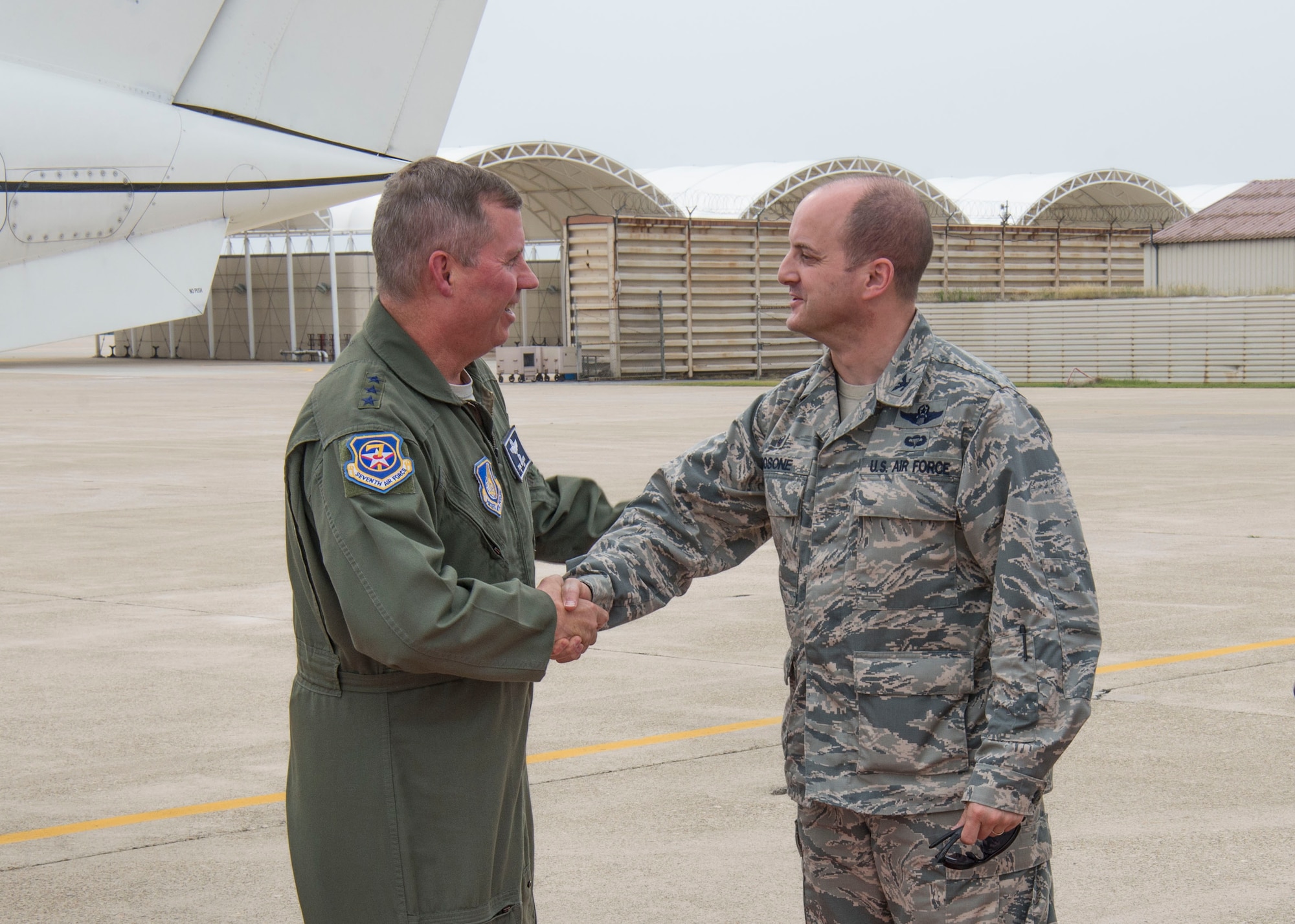 Col. John Bosone, 8th Fighter Wing commander, greets Lt. Gen. Thomas Bergeson, 7th Air Force commander, after arriving at Kunsan Air Base, Republic of Korea, June 22, 2018. During the visit Bergeson met with Wolf Pack leadership and visited Airmen. (U.S. Air Force photo by Tech. Sgt. Charles McNamara)