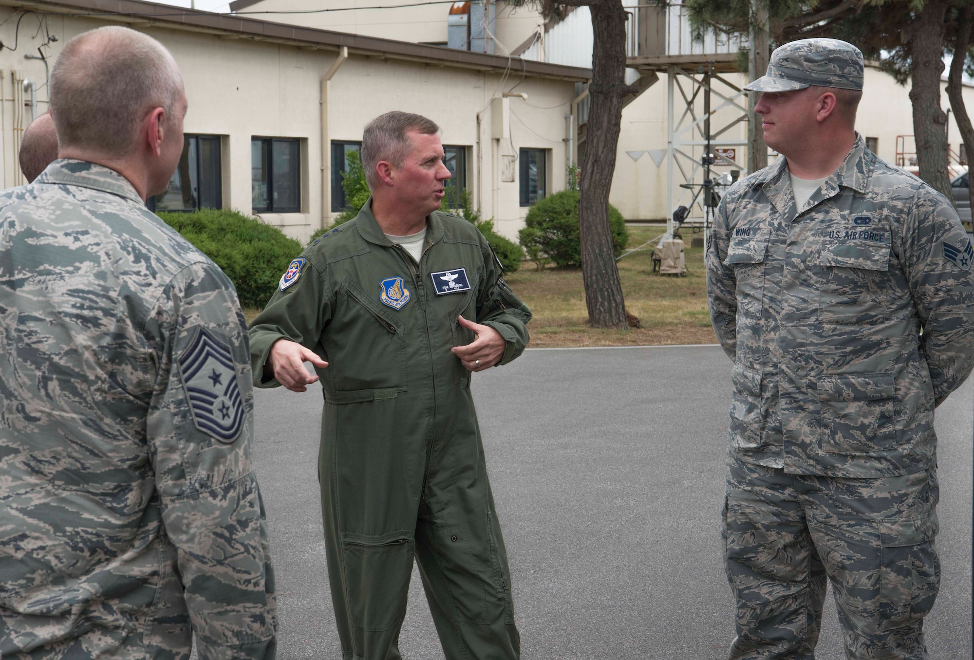 Lt. Gen. Thomas Bergeson, 7th Air Force commander, speaks with Senior Airman Alexander Wing, a vehicle operator from the 8th Logistics Readiness Squadron, during a visit at Kunsan Air Base, Republic of Korea, June 22, 2018. While at Kunsan, Bergeson visited Airmen and met with Wolf Pack leadership from across the base. (U.S. Air Force photo by Tech. Sgt. Charles McNamara)
