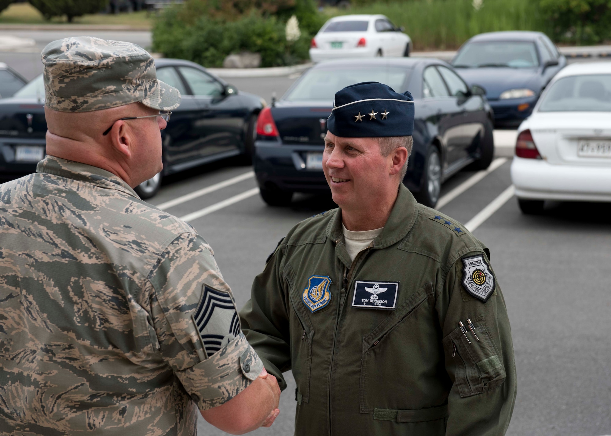 Chief Master Sgt. Robert Baker, Chief Enlisted Manager from the 8th Communication Squadron, welcomes Lt. Gen. Thomas Bergeson, 7th Air Force commander, to Kunsan Air Base, Republic of Korea, June 22, 2018. While at Kunsan, Bergeson met with the Wolf Pack’s top enlisted leaders and visited Airmen. (U.S. Air Force photo by Staff Sgt. Levi Rowse)