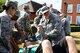 U.S. Airmen perform first aid to simulated injured bystanders during an exercise at RAF Mildenhall, England, June 20, 2018. The exercise tested the responsiveness and readiness of base personnel. (U.S. Air National Guard photo by Tech. Sgt. Daniel Gagnon)