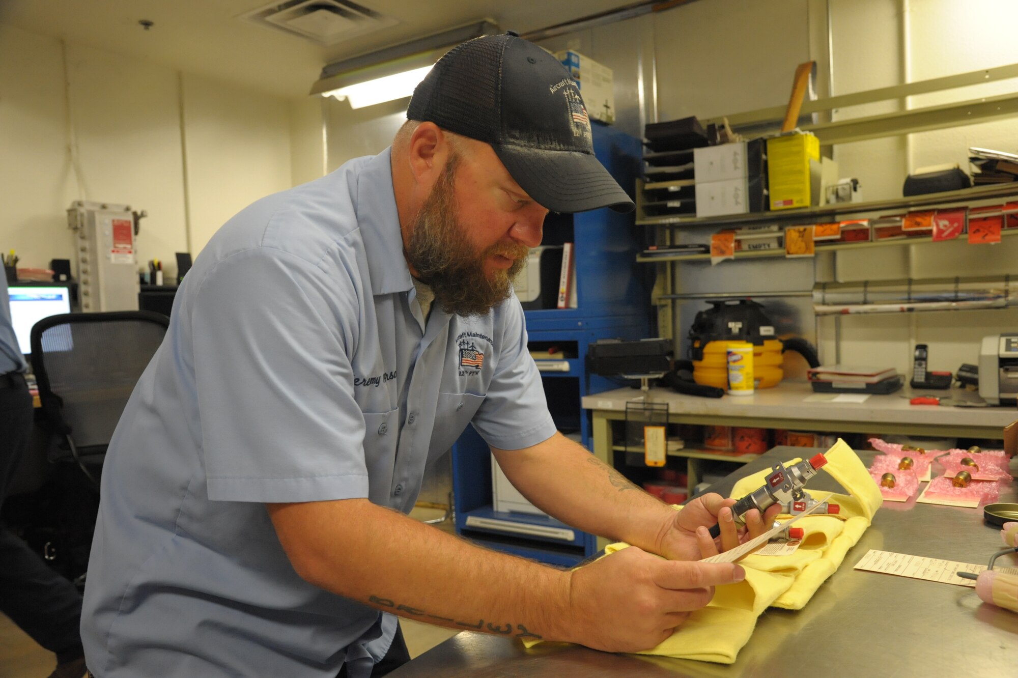 Jeremy Peterson, 12th Flying Training Wing, Maintenance Group Munitions Flight inspector, inspects a time delay initiator, June 18 at Joint Base San Antonio-Randolph. The 12th MXG Munitions Flight provides the 12th FTW’s flying and fighter training squadrons, the 902nd Security Forces Squadron and other units with the explosives they need to carry out their missions. (U.S. Air Force photo by Joel Martinez)