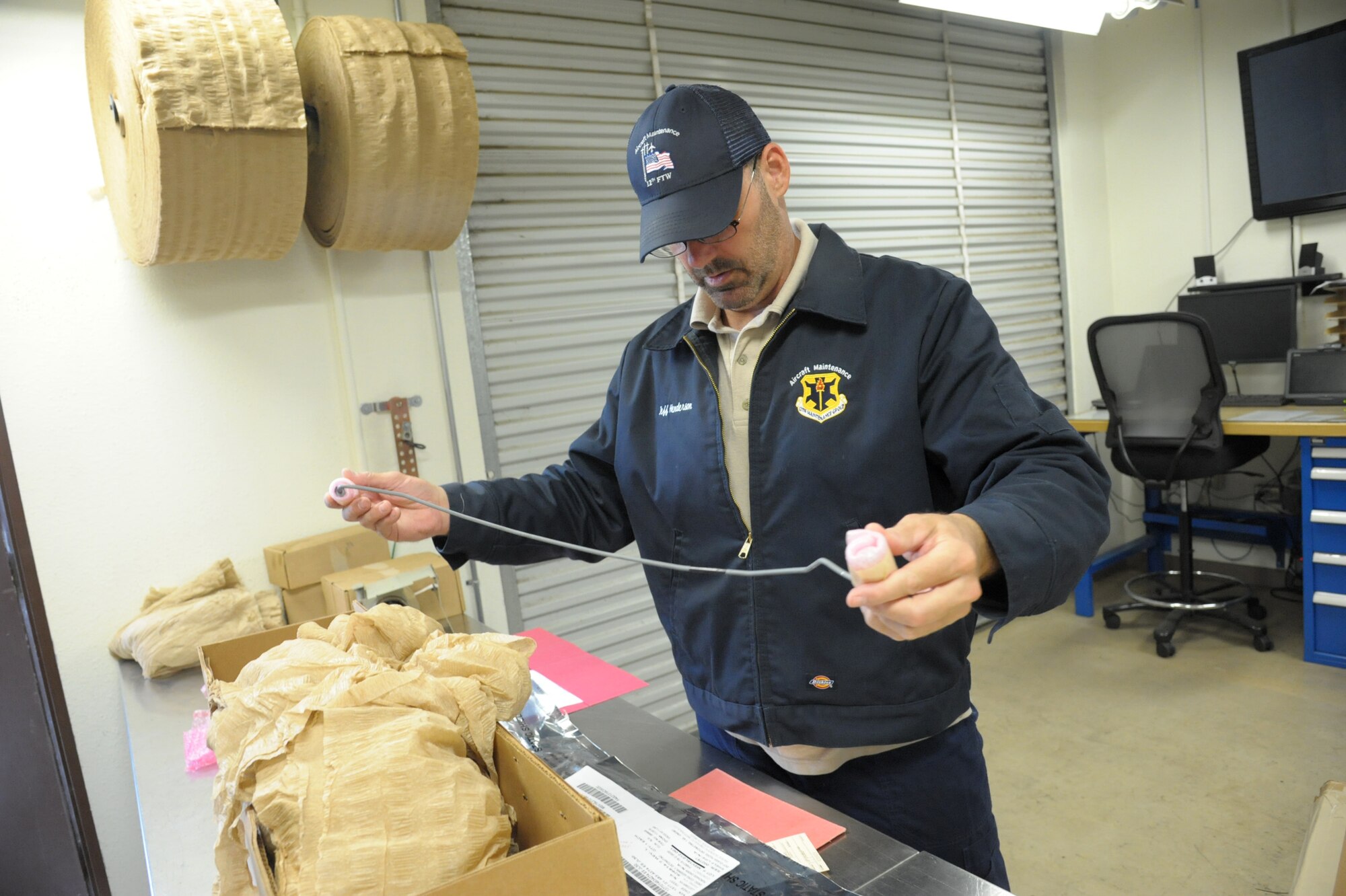 Jeff Henderson, 12th Flying Training Wing, Maintenance Group Munitions Flight inspector, inspects a detonating cord assembly, June 18, 2018, at Joint Base San Antonio-Randolph, Texas. The 12th MXG Munitions Flight provides the 12th FTW’s flying and fighter training squadrons, the 902nd Security Forces Squadron and other units with the explosives they need to carry out their missions. (U.S. Air Force photo by Joel Martinez)