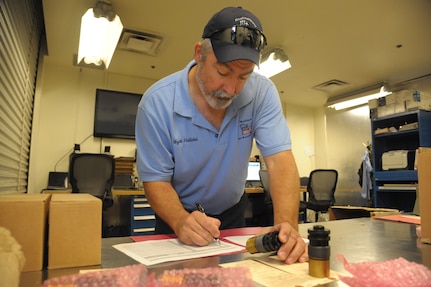 Wyatt Hollidai, 12th Flying Training Wing, Maintenance Group Munitions Flight inspector, prepares some cartridges, impulse ammunition for storage, June 18, 2018, at Joint Base San Antonio-Randolph, Texas. The 12th MXG Munitions Flight provides the 12th FTW’s flying and fighter training squadrons, the 902nd Security Forces Squadron and other units with the explosives they need to carry out their missions. (U.S. Air Force photo by Joel Martinez)