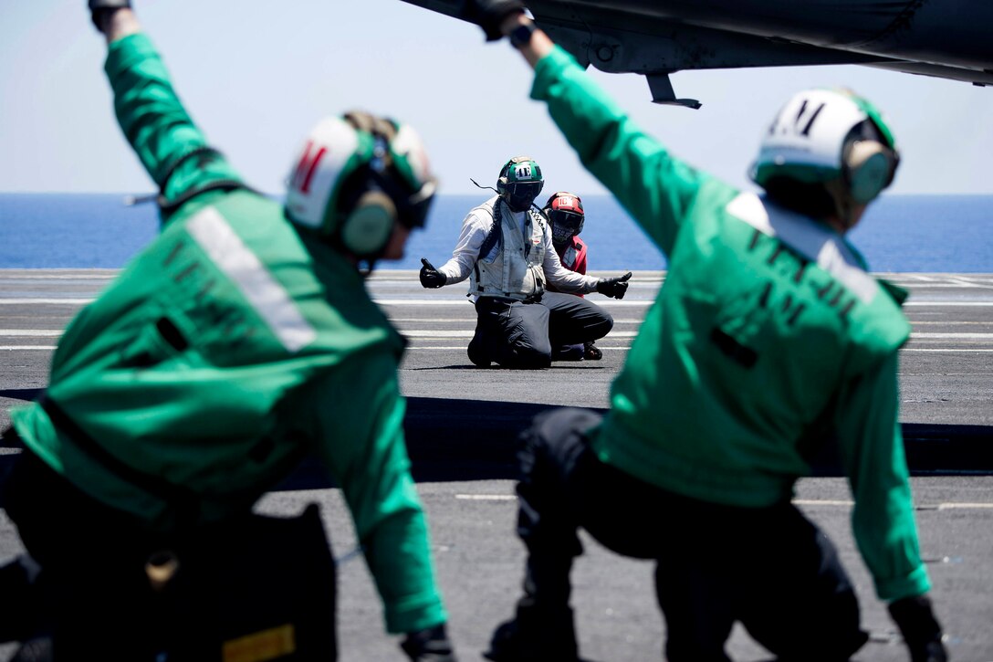 Sailors prepare to launch an F/A-18E Super Hornet aircraft.