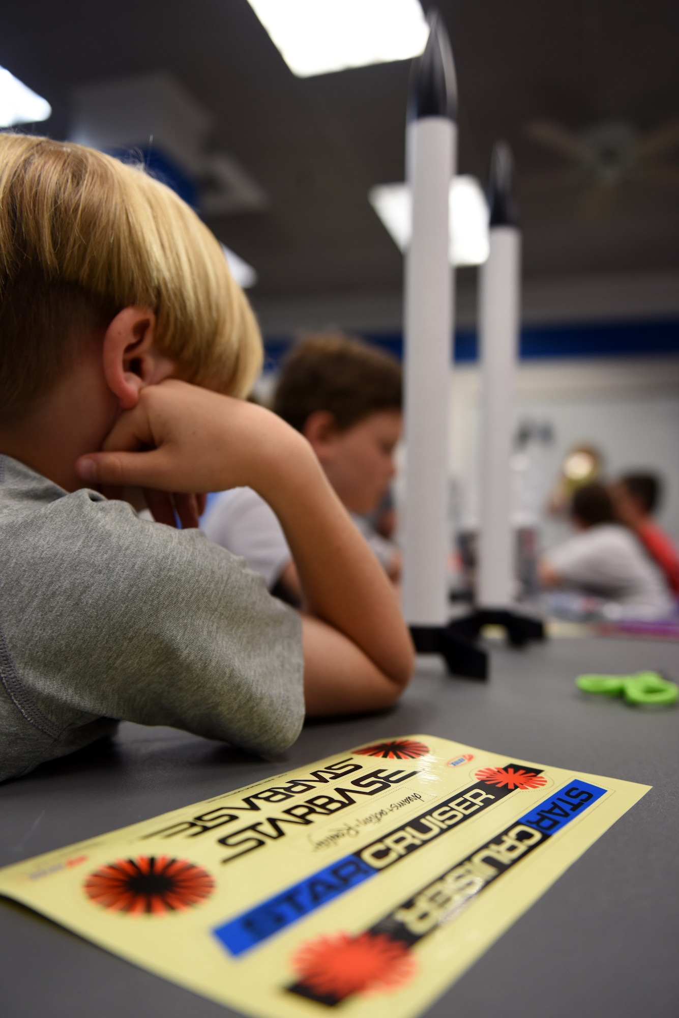 Leal Johnson, son of local firefighter Holly Johnson, learns how to put together a model rocket during a lesson held at the North Carolina Air National Guard Base, Charlotte-Douglas International Airport, June 18, 2018. The children are part of the annual Department of Defense STARBASE summer camp program and learn various applications of science, technology, engineering, and math.