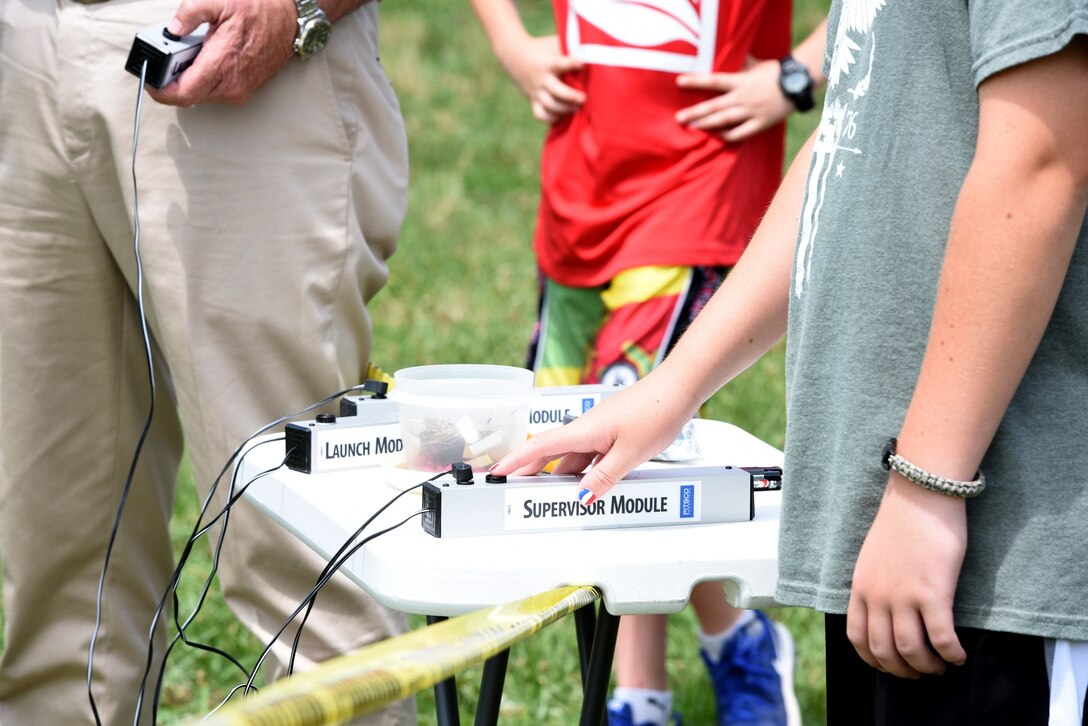 Mark Odell, son of U.S. Air Force Senior Airman Frank Odell, vehicle operator with the 145th Logistics Readiness Squadron, launches his model rocket near Reid Park Academy Charlotte, N.C., June 21, 2018. Odell, along with other campers and teachers are part of the annual Department of Defense STARBASE summer camp program with the North Carolina Air National Guard and they learn various applications of science, technology, engineering, and math.