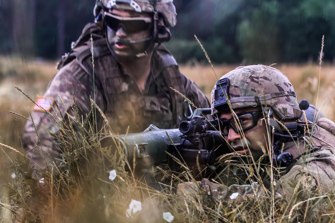 A soldier aims a Carl Gustaf recoilless rifle during a multinational training event.