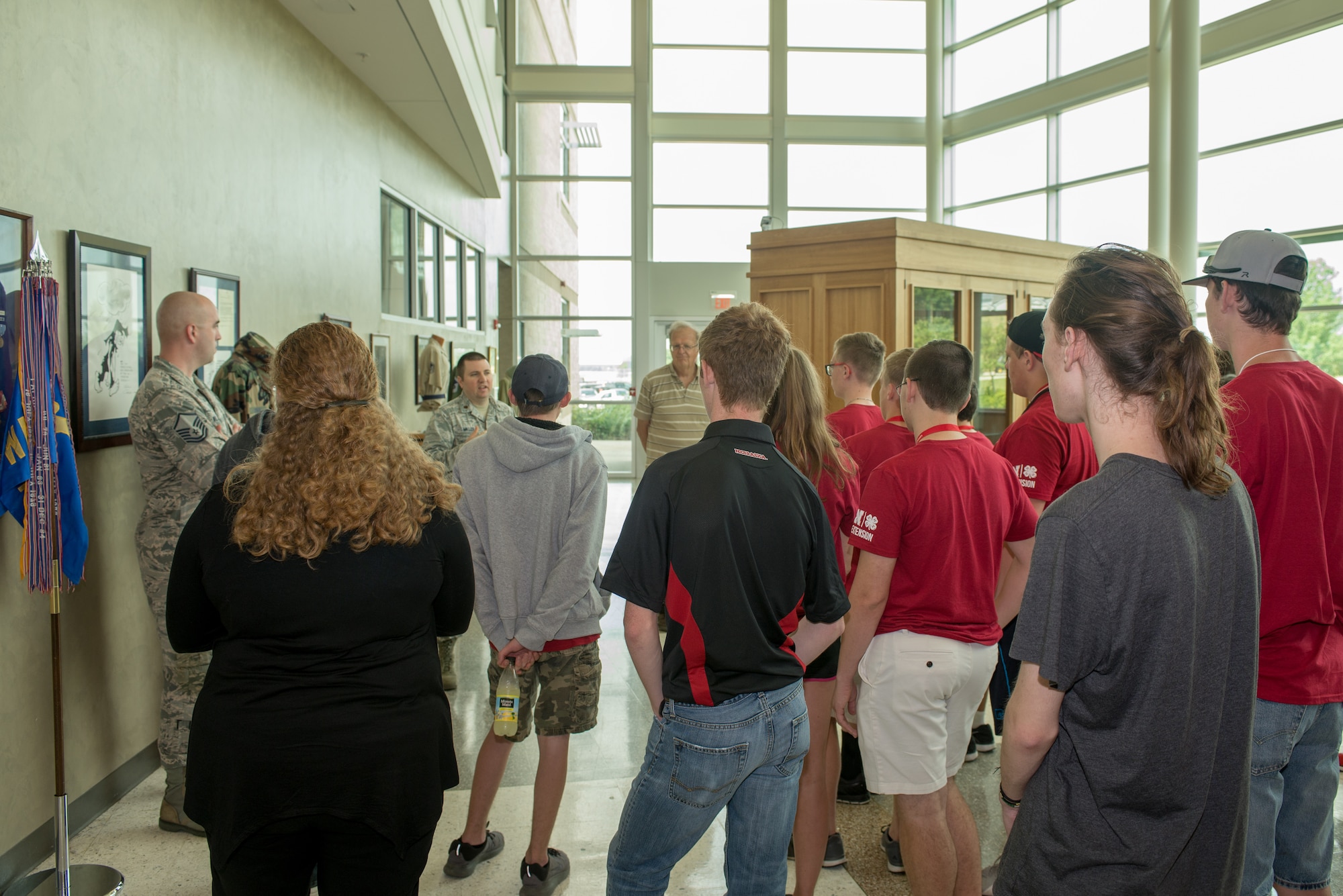 U.S. Air Force Maj. Brian Miller, 557th Weather Wing (WW) commander’s action group chief, describes opportunities in Air Force Weather to students from the University of Nebraska-Lincoln Weather Camp during a tour of the 557th WW June 12, 2018, Offutt Air Force Base, Nebraska. Students also viewed the wing’s historical artifacts before touring the wing’s Space Weather Operations Center and High Performance Computer Center. (U.S. Air Force photo by Paul Shirk)