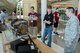 U.S. Air Force Maj. Brian Miller, 557th Weather Wing commander’s action group chief, look at an operational linescan system (OLS) from a defense meteorological satellite with students from a University of Nebraska-Lincoln Weather Camp during a tour of the weather wing June 12, 2018, Offutt Air Force Base, Nebraska. The OLS is used on meteorological satellites to view cloud cover using visible and infrared light. (U.S. Air Force photo by Paul Shirk)