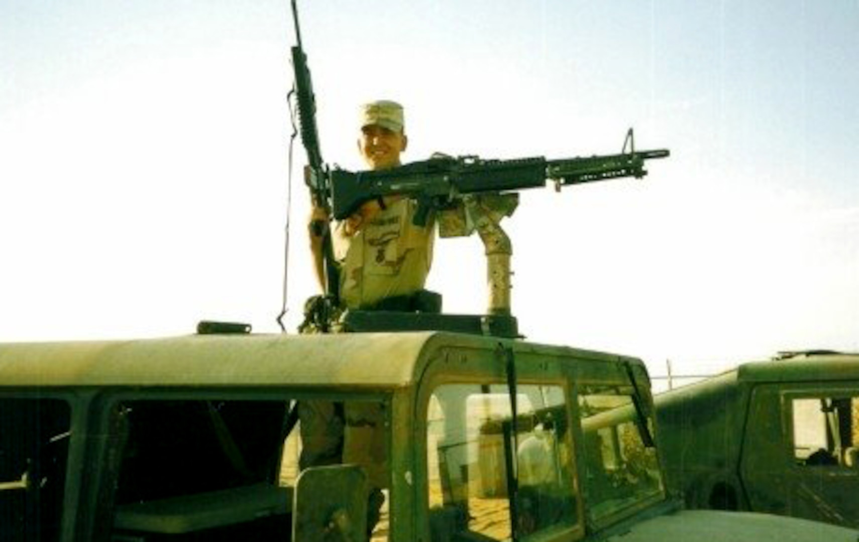 Airman Ryan Kaono poses in a Humvee in during his deployment to Saudi Arabia in 1996.