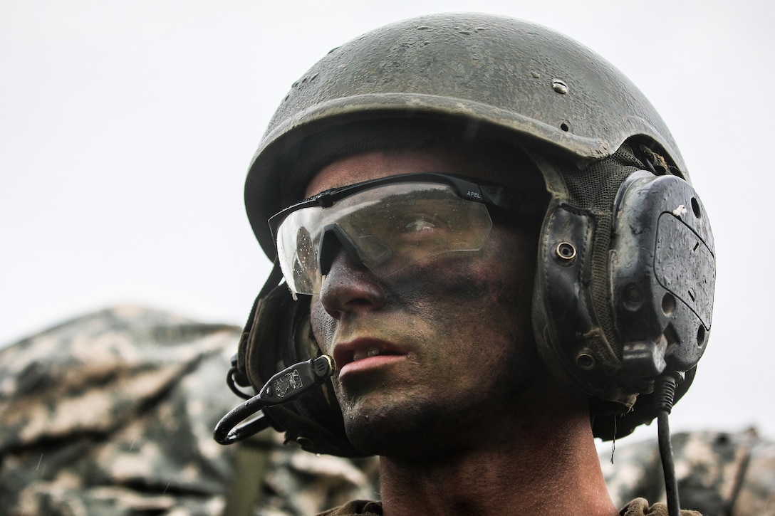 A soldier scans his sector looking for opposing forces.