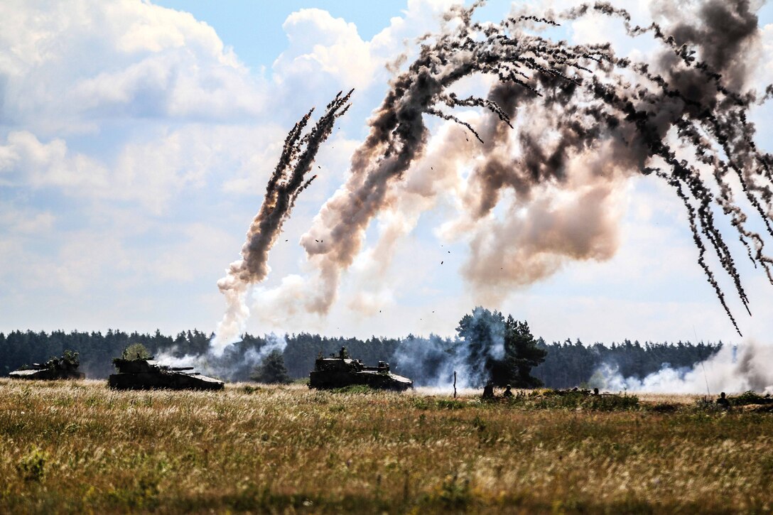 Polish army Rak 120 mm self-propelled mortar systems fire for effect.