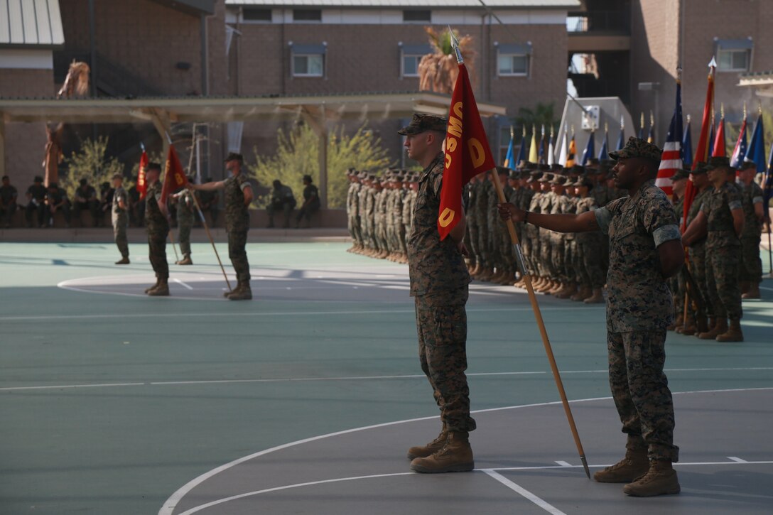 Marines with Communication Training Battalion, Marine Corps Communication-Electronics School, stand in formation during a change-of-command ceremony aboard the Marine Corps Air Ground Combat Center, Twentynine Palms, Calif., June 13, 2018. During the ceremony, Lt. Col. Barian Woodward relinquished command of the battalion to Lt. Col. Russell Savatt at the ceremony. (U.S. Marine Corps photo by Lance Cpl. Preston L. Morris)