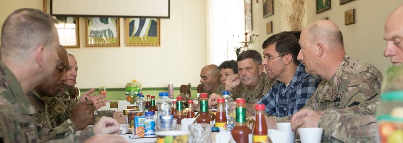 Secretary of the Army, Dr. Mark T. Esper sits with senior leaders of U.S. Army Central during a breakfast meeting at Camp Arifjan, Kuwait, June 21, 2018. On his first visit to Kuwait as the 23rd Secretary of the Army Esper shared his goal of modernizing the U.S. Army's equipment and training with Soldiers in USARCENT while he toured facilities at Camp Arifjan.
