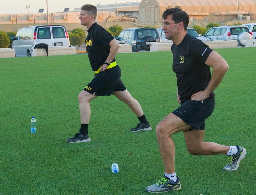 Secretary of the Army, Dr. Mark T. Esper and U.S. Army Cpt. Jill King, chief of the 49th Theater Gateway Company, perform the rear lunge exercise during physical readiness training with the Secretary of the Army, Dr. Mark T. Esper at Camp Arifjan, Kuwait with Soldiers from the 49th Theater Gateway Company, June 21, 2018. Esper encourages Soldiers' to maintain their physical fitness so they are always ready to fight.