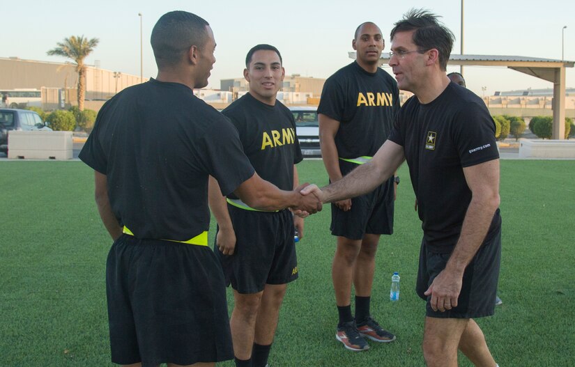 Secretary of the Army, Dr. Mark T. Esper, greets Soldiers during physical readiness training at Camp Arifjan, Kuwait, June 21, 2018. The Soldiers were excited to meet the newly appointed secretary, as this was his first time visiting Camp Arifjan since he assumed his new position in November 2017.