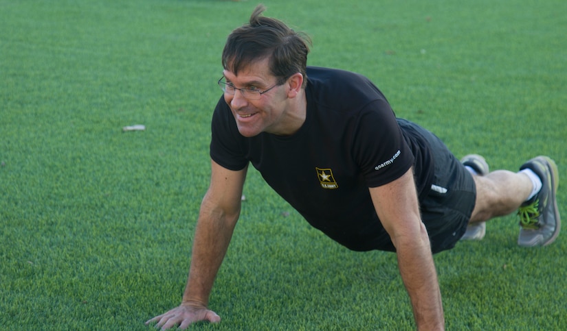 Secretary of the Army, Dr. Mark T. Esper, holds the front-leaning rest position during physical readiness training with Soldiers from the 49th Theater Gateway Company at Camp Arifjan, Kuwait, June 21, 2018. Esper believes that physical fitness is essential to maintaing Soldiers' readiness.