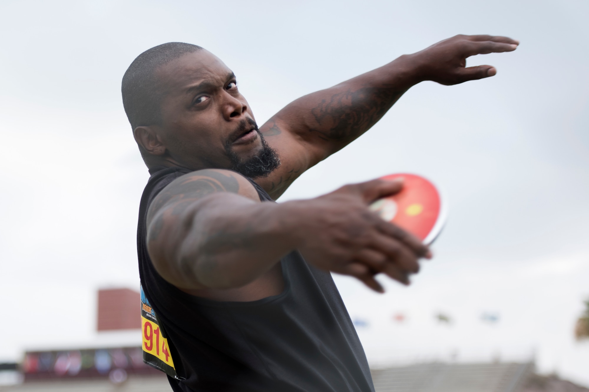 An adaptive athlete and Paralympic prospect throws a discus during the Desert Challenge adaptive sports competition at Arizona State University from June 15-16, 2018, in Tempe, Ariz. Multiple veteran athletes competed at the challenge. (U.S. Air Force photo by Airman 1st Class Jacob Wongwai)