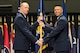 Lt. Gen. Robert D. McMurry, Air Force Life Cycle Management Center commander, passes the guidon to Col. Thomas Sherman as he assumes command of the 88th Air Base Wing during a ceremony inside the National Museum of the United States Air Force at Wright-Patterson Air Force Base June 19. Sherman replaced Col. Bradley McDonald. (U.S. Air Force photo/Wesley Farnsworth)