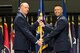 Lt. Gen. Robert D. McMurry, Air Force Life Cycle Management Center commander, passes the guidon to Col. Thomas Sherman as he assumes command of the 88th Air Base Wing during a ceremony inside the National Museum of the United States Air Force at Wright-Patterson Air Force Base June 19. Sherman replaced Col. Bradley McDonald. (U.S. Air Force photo/Wesley Farnsworth)
