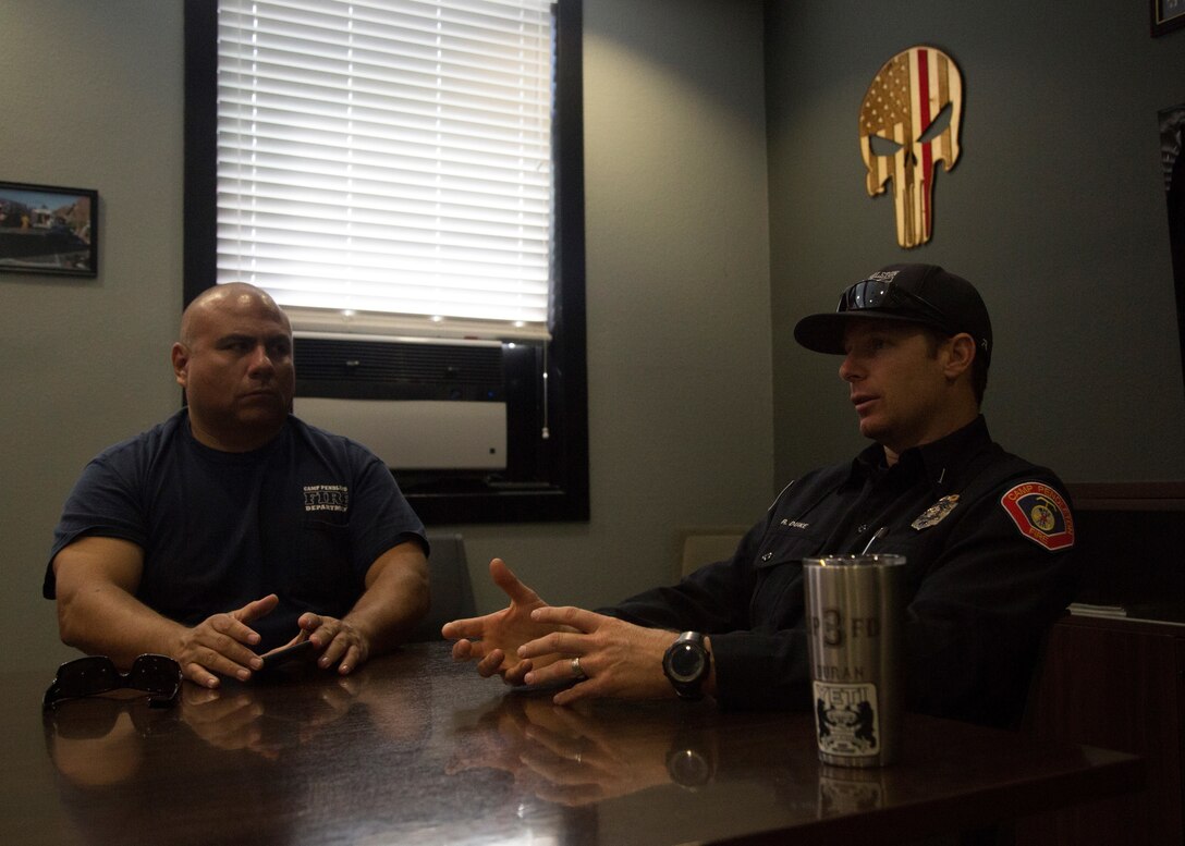 Rusty Duke, right, a lieutenant with Marine Corps Base Camp Pendleton Fire Station #1, leads a morning meeting at Fire Station #1, MCB Camp Pendleton, California, June 15, 2018. Duke has been a firefighter for 18 years, protecting local communities from hundreds of fires and leading junior firefighters. (U.S. Marine Corps photo by Cpl. Lukas Kalinauskas)