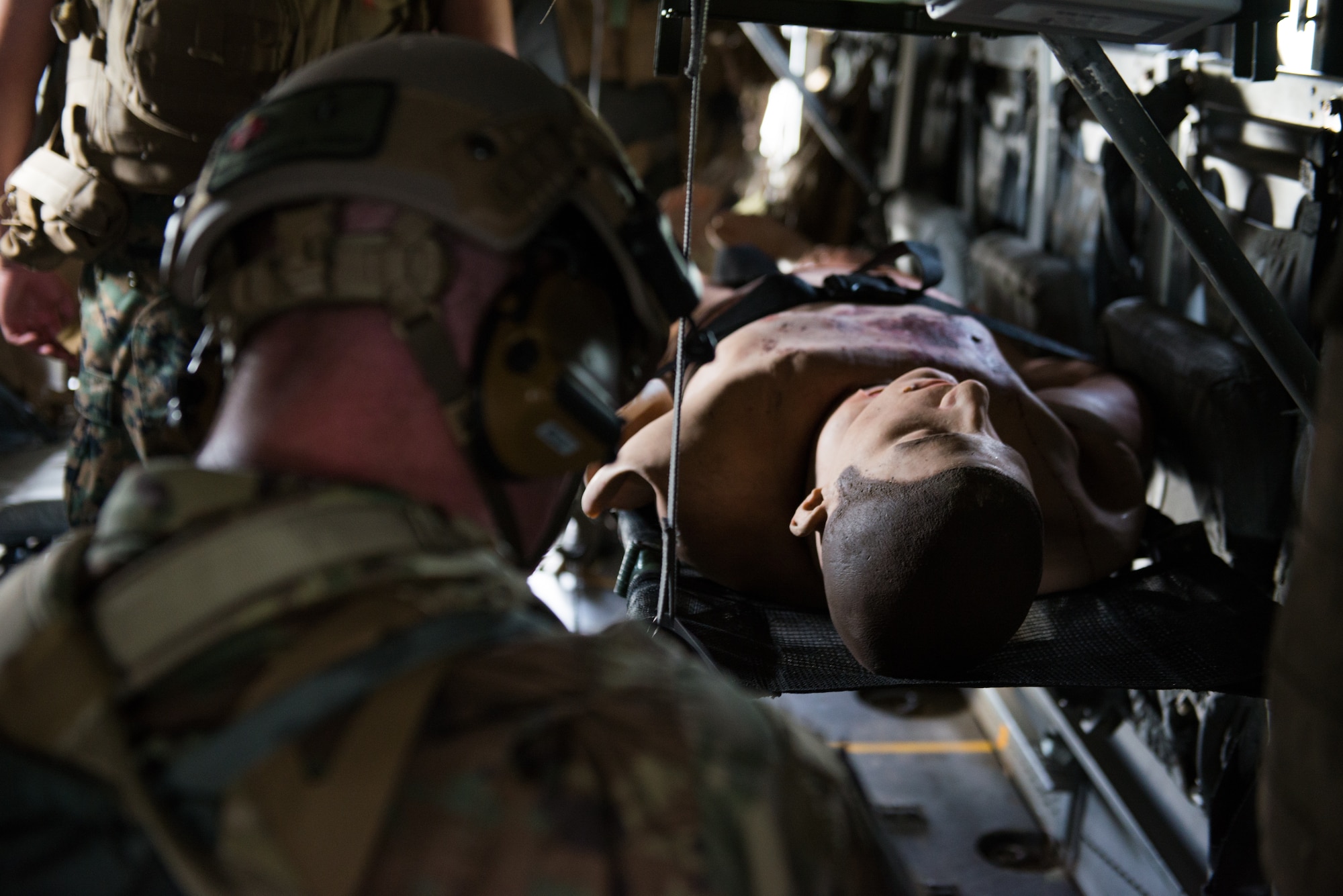 A member of the U.S. Air Force from the 353rd Special Operations Squadron, respond to a simulated casualty during a medical exercise, June 6, 2018, at Camp Hansen, Okinawa, Japan. The Air Force performs joint medical exercises with other U.S. forces regularly in Okinawa to better prepare service members for real world emergencies. (U.S. Air Force photo by Senior Airman Thomas Barley)