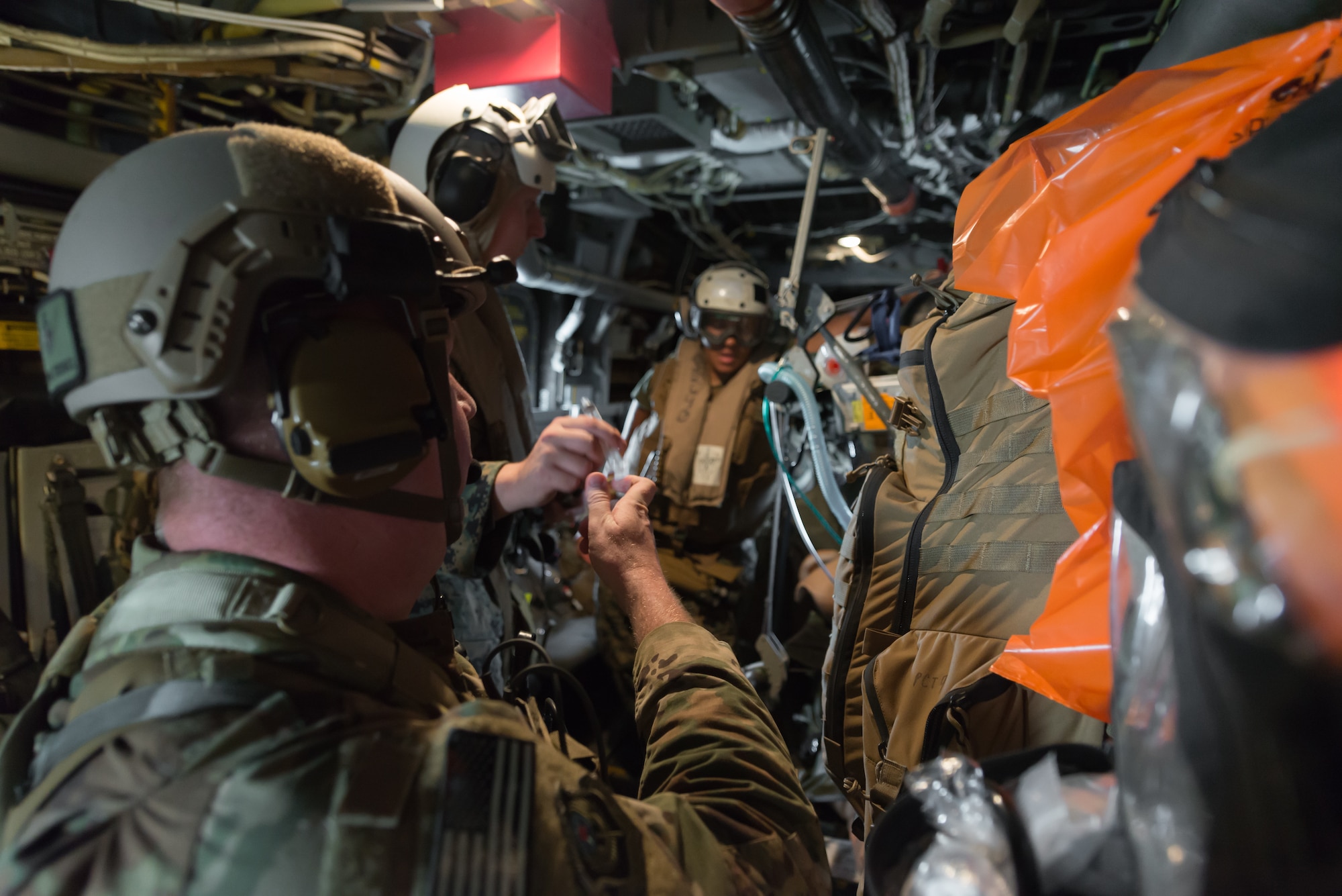 Members of the U.S. Air Force and Navy respond to a simulated casualty during a medical exercise, June 6, 2018, at Camp Hansen, Okinawa, Japan. The Air Force performs joint medical exercises with other U.S. forces regularly in Okinawa to better prepare service members for real world emergencies. (U.S. Air Force photo by Senior Airman Thomas Barley)