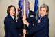 U.S. Air Force Col. Janet Urbanski, 17th Medical Group commander, accepts the guideon from Col. Kari Stone, 17th Medical Operation Squadron commander, during the 17th MDOS Change of Command at the Event Center on Goodfellow Air Force Base, Texas, June 21, 2018. The guideon signifies the passing of command from one commander to the next. (U.S. Air Force photo by Airman 1st Class Seraiah Hines/Released)