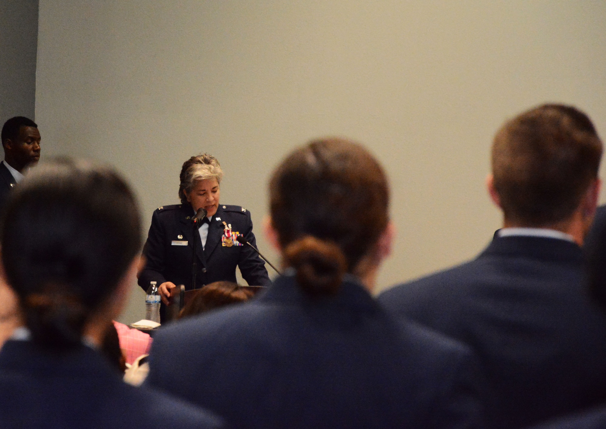 U.S. Air Force Col. Kari Stone, 17th Medical Operation Squadron outgoing commander, bids farewell during the MDOS Change of Command at the Event Center on Goodfellow Air Force Base, Texas, June 21, 2018. Stone expressed gratitude to Airmen of the 17th MDOS for their commitment to service. (U.S. Air Force photo by 2nd Lt. Wyatt Thomas/Released)