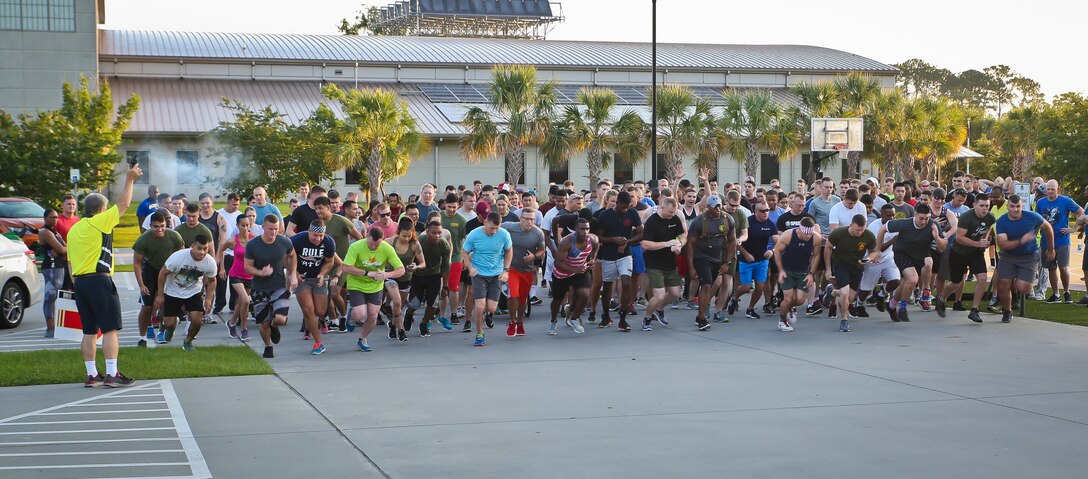 Marine, Sailors, and family members begin the Famous Founders 5K aboard Marine Corps Air Station Beaufort June 15. The run was held by Marine Corp Community Services South Carolina as part of the Semper Fit Summer Challenge. Runners were encouraged to wear a shirt, costume or item representing the runners favorite famous founder of a political or social movement and after the run, awards were given for each age group.