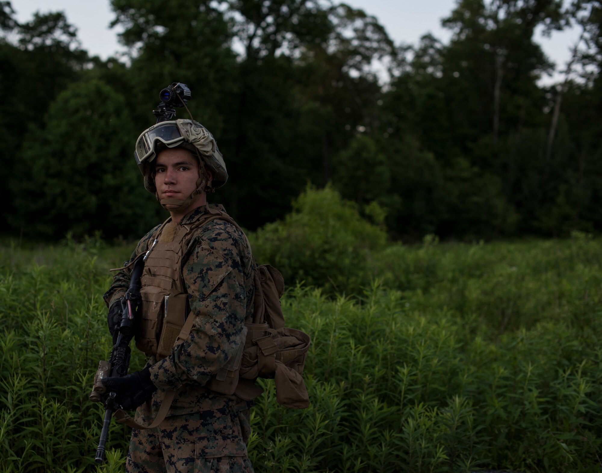 U.S. Marine Corps Pfc. Darian Houghtaling, Company F, 2nd Battalion, 25th Marine Regiment rifleman, poses for a picture during a reconnaissance exercise on Fort Indiantown Gap, P.A., June 14, 2018. The mission was a part of a large-scale operation called the 2018 Marine Aircraft Group-49 Combined Arms Exercise. The MCAX was held at Joint Base McGuire-Dix-Lakehurst, normally held on the West Coast, Joint Base MDL gives the Marines a unique opportunity to work with their sister services. (U.S. Air Force photo by Airman Ariel Owings)