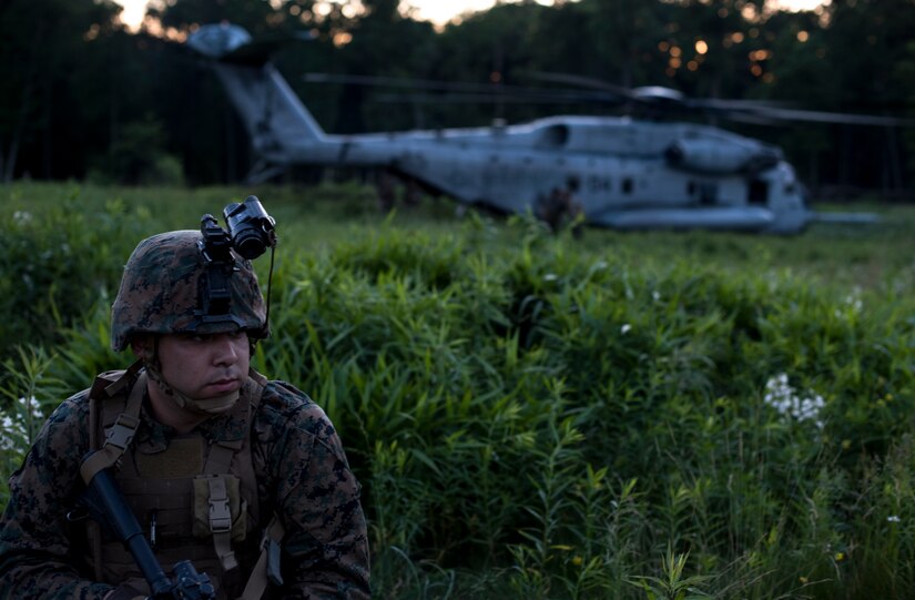 A Marine stands guard near the site of the Marine Battalion