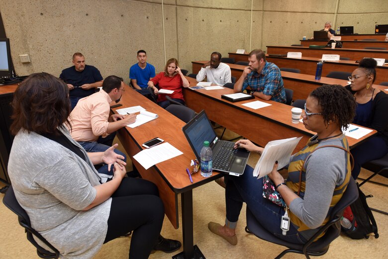 Participants of the Hydropower Acquisition Course consider scenarios requiring them to identify issues and develop proposed solutions during an exercise to culminate the course June 22, 2018 in Nashville, Tenn., at Tennessee State University’s Avon Williams Campus. (USACE Photo by Lee Roberts)