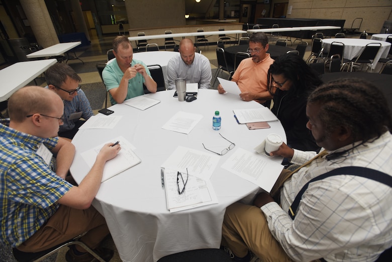 Participants of the Hydropower Acquisition Course consider scenarios requiring them to identify issues and develop proposed solutions during an exercise to culminate the course June 22, 2018 in Nashville, Tenn., at Tennessee State University’s Avon Williams Campus. (USACE Photo by Lee Roberts)