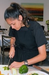 Victoria Ortiz cuts a bell pepper in a cooking class during the Resiliency Day workshop June 15 at the Vogel Resiliency Center at Joint Base San Antonio-Fort Sam Houston. The workshop allowed students of JBSA members from area high schools to learn about life skills, including how to prepare and cook nutritious, delicious meals.