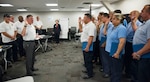 Robert West, 12th Maintenance Group director, administers an oath of service to members of the 12th MXG who have completed a civilian professional development course June 22, 2018, at Joint Base San Antonio-Randolph, Texas. An estimated 140 employees have completed the program to date, and the 12th MXG offers the workshop to 12 employees once a quarter.
