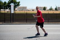 Special Olympian Alexis Norman, participates in the 2018 Special Olympics Torch Run at Travis Air Force Base, Calif., June 20, 2018. The annual event brings law enforcement from the community and the base together to show their support for Special Olympics and the athletes who participate in the games. (U.S. Air Force Photo by Master Sgt. Joey Swafford)
