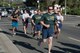 Airmen from the 60th Security Forces Squadron run with Special Olympics athletes at Travis Air Force Base, Calif., June 21, 2018, during the annual Law Enforcement Torch Run. During the run, a Special Olympics athlete carried the torch known as the “Flame of Hope.” The Northern California Special Olympics Summer Games will take place at the University of California Davis from June 22 - 24. (U.S. Air Force photo by Tech. Sgt. James Hodgman)