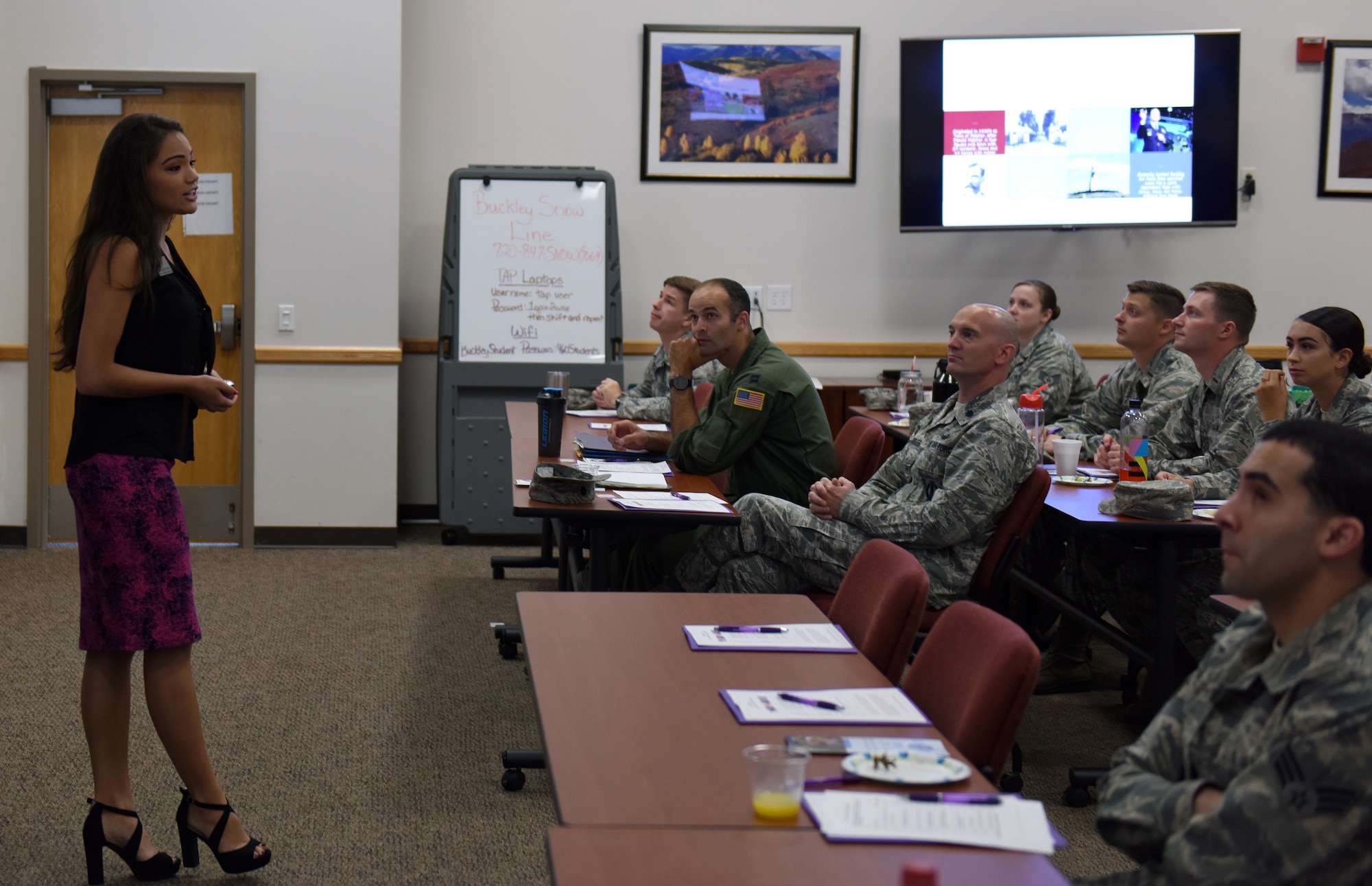 Rachel Gruber, far left, Aurora Chamber of Commerce director of business development and events, speaks to members of Team Buckley during the newcomer’s orientation at Buckley Air Force Base, Colorado, June 20, 2018.