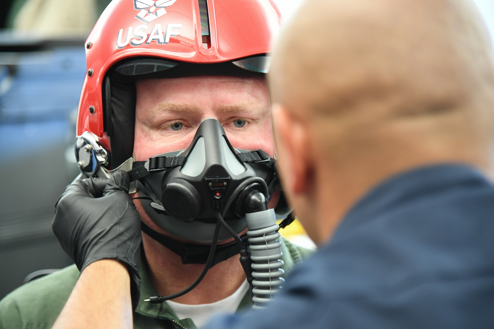Sergeant Aaron Thompson, Utah Washington County Sheriff, gets fitted for his oxygen mask with the help of  Tech. Sgt. Ed Portan, U.S. Air Force Thunderbirds aircrew flight equipment, June 22, 2018, at Hill Air Force Base, Utah. Thompson was selected to fly with the Thunderbirds as part of their Hometown Hero program. (U.S. Air Force photo by Cynthia Griggs)
