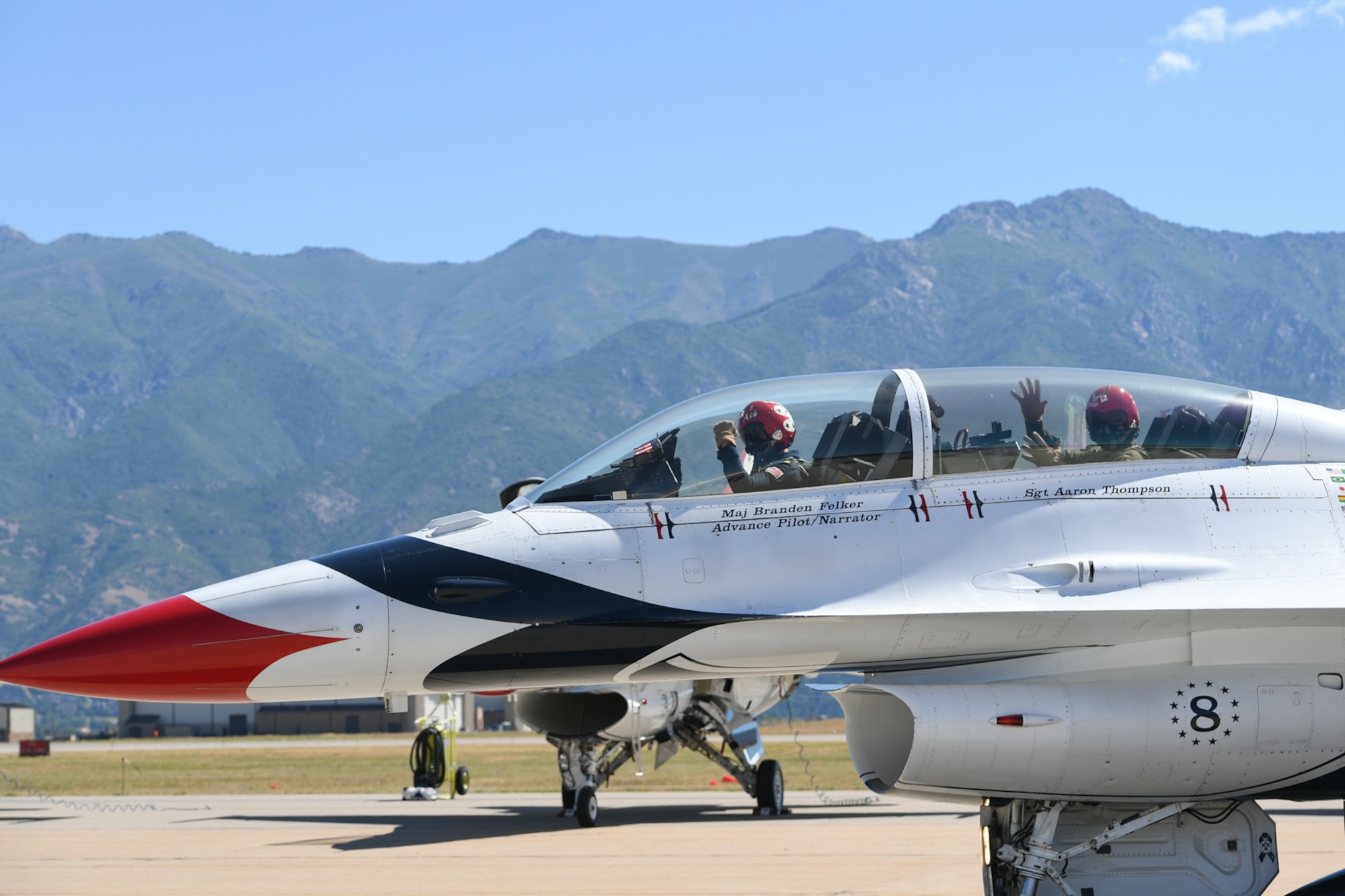 Sergeant Aaron Thompson, Utah Washington County Sheriff, waves at his family and friends before flying with the U.S. Air Force Thunderbirds June 22, 2018, at Hill Air Force Base, Utah. Thompson was selected to fly with the Thunderbirds as part of their Hometown Hero program. (U.S. Air Force photo by Cynthia Griggs)