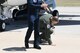 Sergeant Aaron Thompson, Utah Washington County Sheriff, touches the ground upon landing with U.S. Air Force Thunderbirds June 22, 2018, at Hill Air Force Base, Utah. He was selected to fly with the Thunderbirds as part of their Hometown Hero program. (U.S. Air Force photo by Cynthia Griggs)