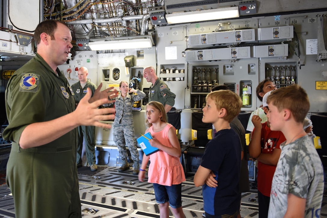 U.S. Air Force Tech. Sgt. Ryan Thompson, loadmaster for the 145th Operations Group, briefs children of North Carolina Air National Guard members as they enter a C-17 Globemaster III aircraft at the N.C. Air National Guard Base, Charlotte-Douglas International Airport, June 18, 2018. The children are part of the annual Department of Defense STARBASE summer camp program and learn various applications of science, technology, engineering and math.