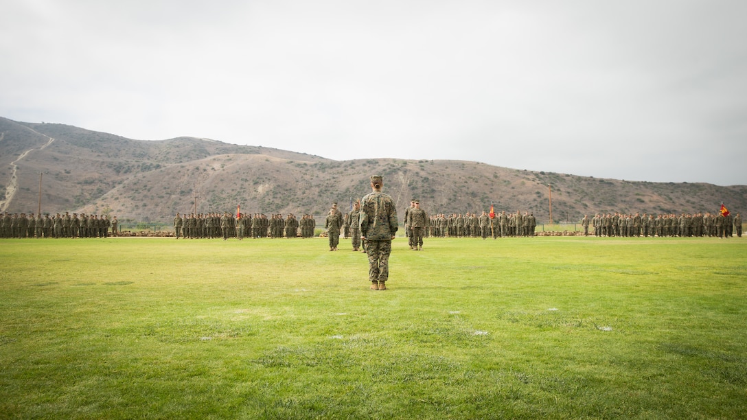 U.S. Marine Corps Lt. Col. Michelle I. Macander, incoming commanding officer of 1st Combat Engineer Battalion, 1st Marine Division, stands at attention in front of Marines with 1st CEB, during a change of command ceremony at Marine Corps Base Camp Pendleton, Calif., June 22, 2018. The ceremony was held as a formal transfer of authority and responsibility from Lt. Col. Christopher M. Haar, offgoing commanding officer of 1st CEB, to Macander.
